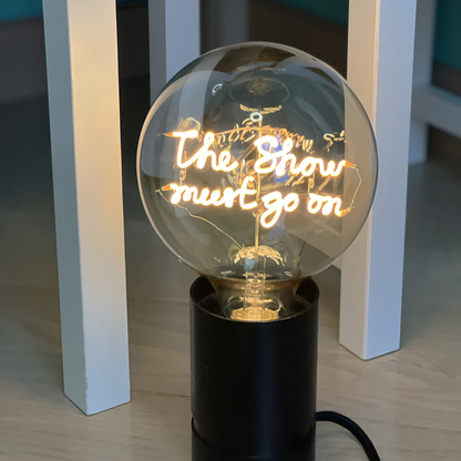 The Show Must Go On MESSAGE IN THE BULB